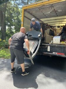 Residential junk pickup crew removing clutter in Wellesley