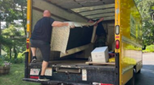 junk removal team loading truck in Worcester