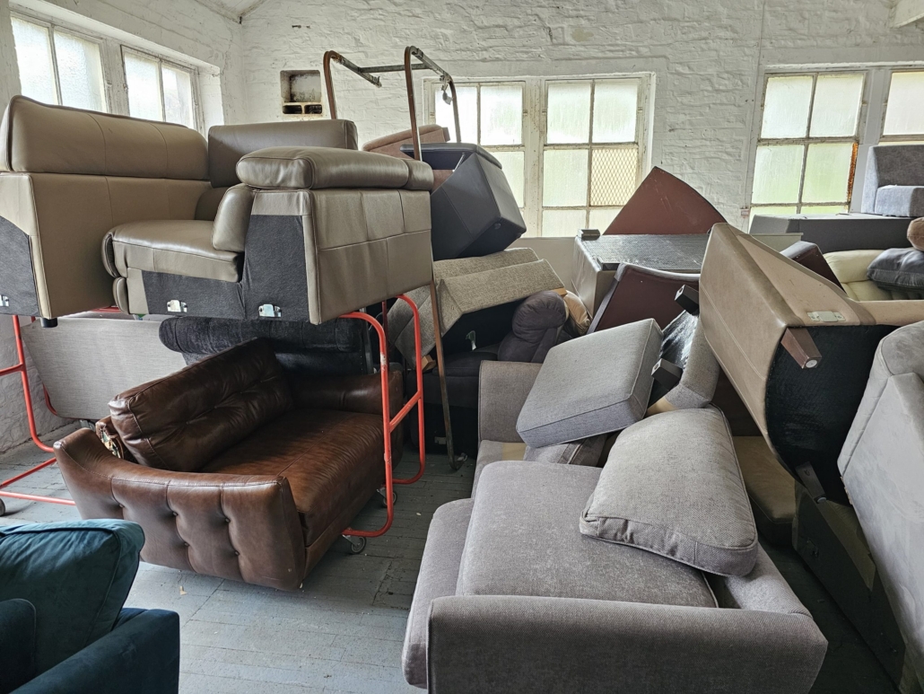 Junk Removal Inc. truck loaded with various furniture items