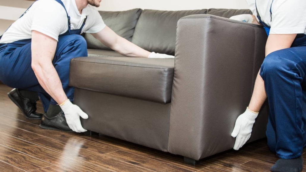 Professional team lifting heavy sofa: Junk Removal Inc